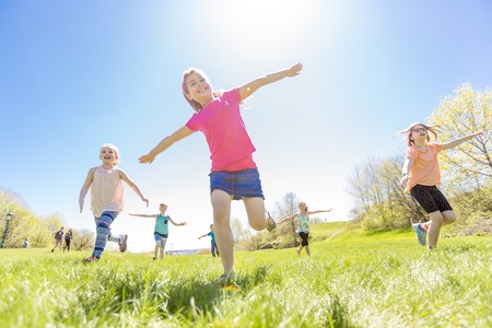 Group of child have fun on a fieldの写真素材