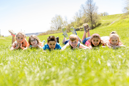 Group of child have fun on a fieldの写真素材
