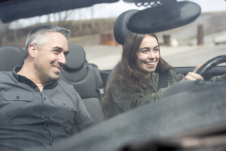 Teen learning to drive or taking driving test.の写真素材