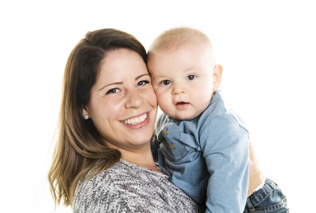 loving mother holding her baby son on white background