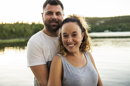 couple on the pier warm summer day having good timeの写真素材