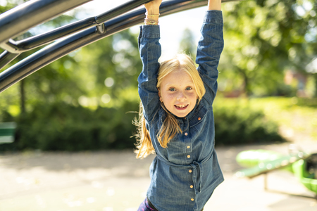 An Adorable little girl enjoying her time in parkの写真素材