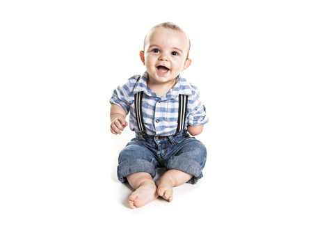 cute baby boy with one hand over white backgroundの写真素材