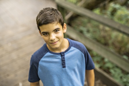 Portrait of a boy outdoors in the forest