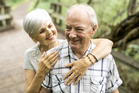 Happy old elderly caucasian couple in a parkの写真素材