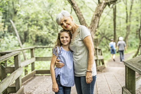 Grandmother and granddaughter spend the weekend in the park