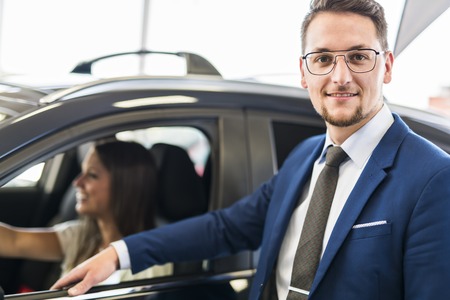 Business car seller working with the clientの写真素材