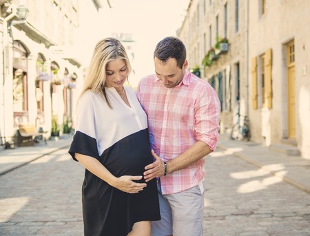 Pregnant couple portrait outside in the neighborhoodの写真素材