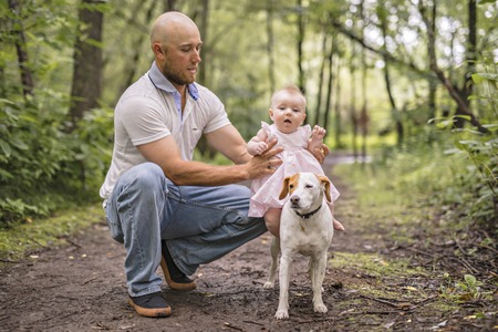 Handsome mechanic job in uniform working on carの写真素材