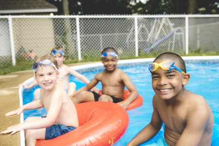 Children in outside swimming poolの写真素材