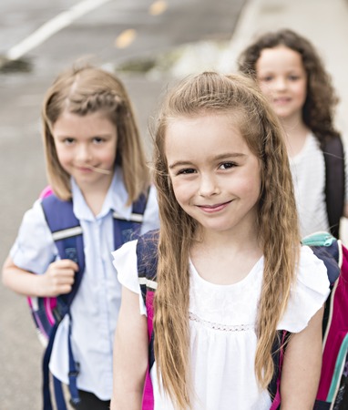 A Group of students outside at school standing togetherの写真素材