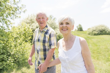 A nice senior couple outside having good time together