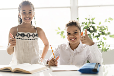 Two Black child doing homework at homeの写真素材