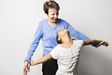 black girl child with grandmother in studio white background