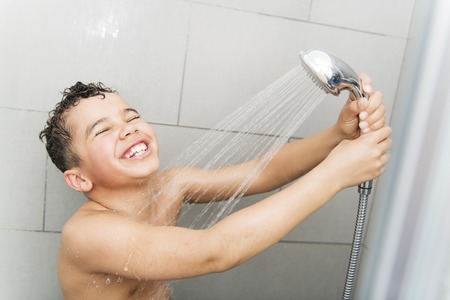 A nice Boy on the shower having funの写真素材