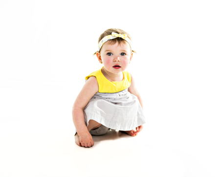 Portrait of a young girl with yellow clothes on photo studioの写真素材