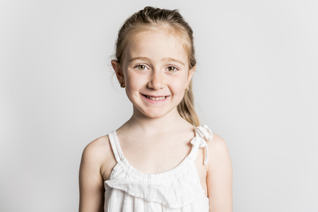 beautiful little fashion model child on white backgroundの写真素材