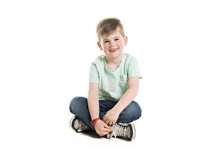 A boy posing over white studio backgroundの写真素材