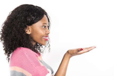 Nice afro american on studio white background with hand in frontの写真素材