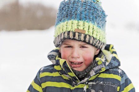 child is crying in the Winter, little boy, crying, upset.の写真素材