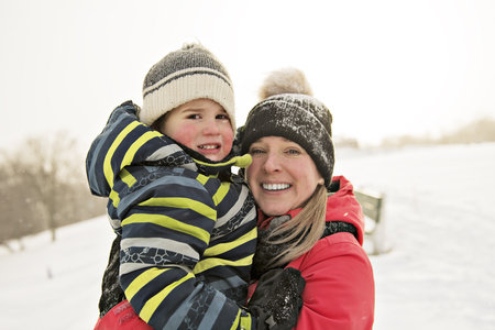 A nice Mother and Son In Snowy Landscapeの写真素材