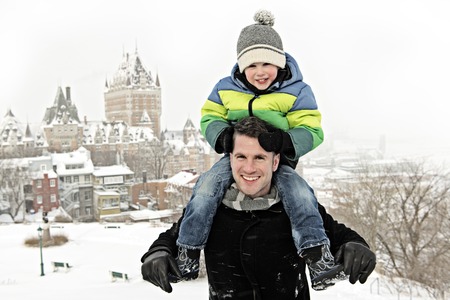 Father And Son on his shoulder In Snowy Landscapeの写真素材