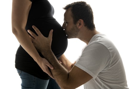 A Pregnant woman belly with future father over white background