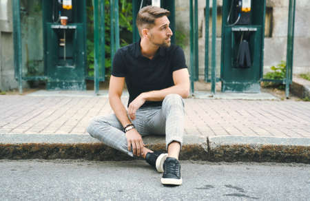 Portrait of a trendy young man on a sunny day in the cityの写真素材