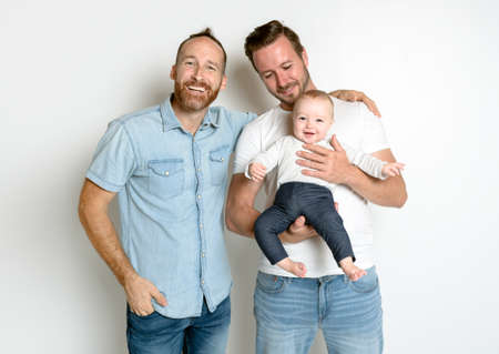 gay or homosexual male couple with their daughter baby over white background