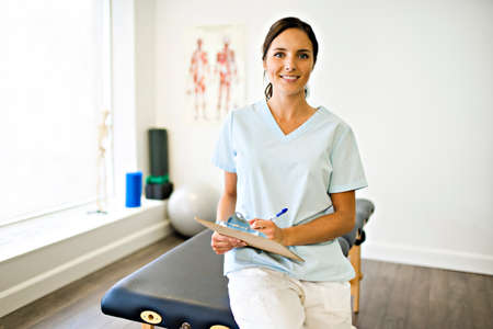 Portrait of a physiotherapy woman smiling in uniformeの写真素材