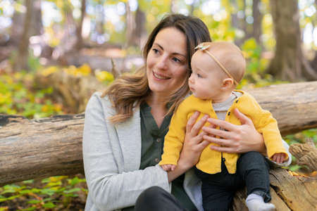 Mother and her child girl in spring park