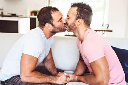 Portrait of a Cute Male gay Couple at Homeの写真素材