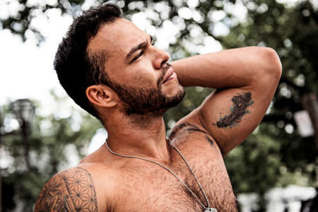 A sexy man outside in a city streetの写真素材