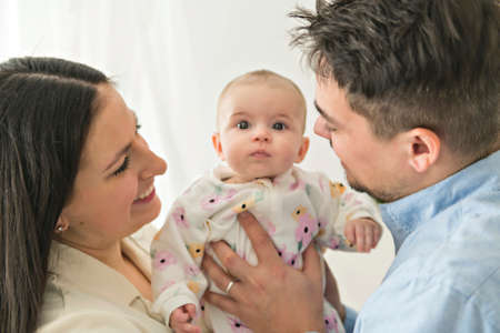 A Young mother and father with newborn