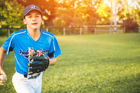 A children baseball players standing on the playground