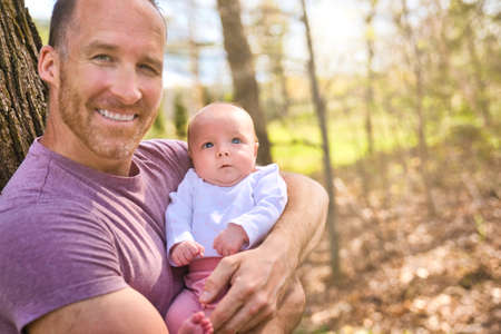 Beautiful father And Baby outdoors. Dad and her Child playing together