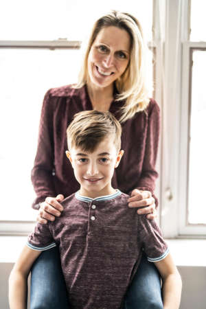 A people and family happy boy with mother at homeの写真素材