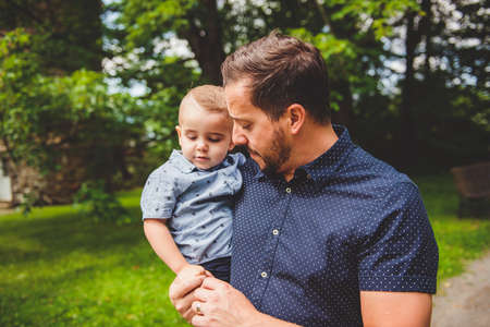 Happy father having fun with his son on the park