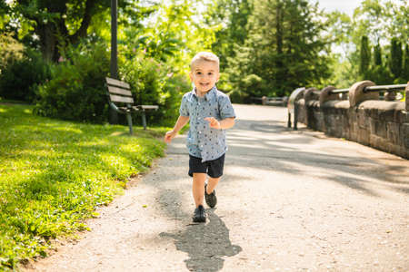Happy boy child enjoying time at the parkの写真素材