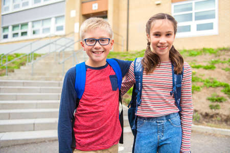group of kids on the school background having fun