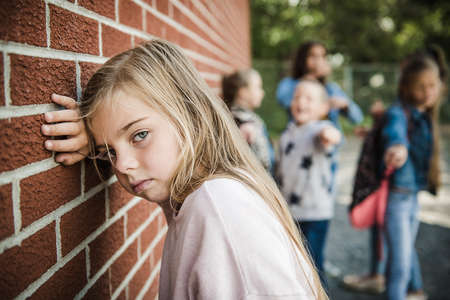 sad intimidation moment Elementary Age Bullying in Schoolyardの写真素材