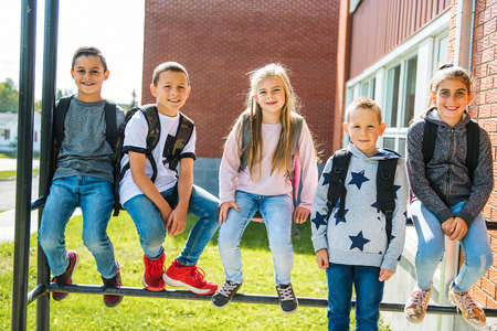 group of kids on the school background having fun