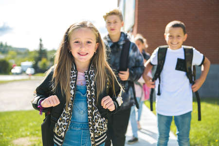 group of kids on the school background having fun