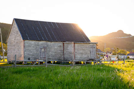 A Bonaventure Island and fisherman houses and Perce Rock in Gaspesie