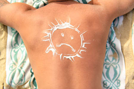 A Man with ungry sun on his backの写真素材