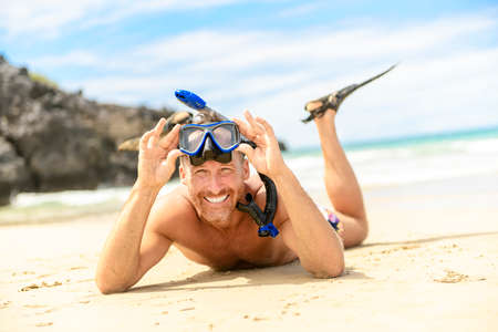 man with mask for snorkling at the seaside beach