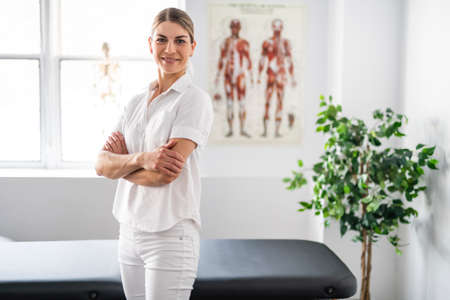 A Modern rehabilitation physiotherapy woman worker at jobの写真素材