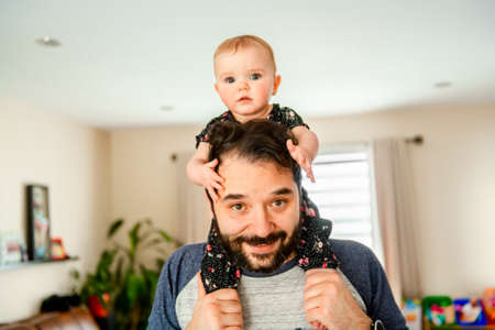 A Nice father with baby at home