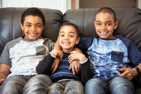 Cute happy african american sit on the livingroom at home