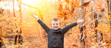 portrait of child in the autumn season outside